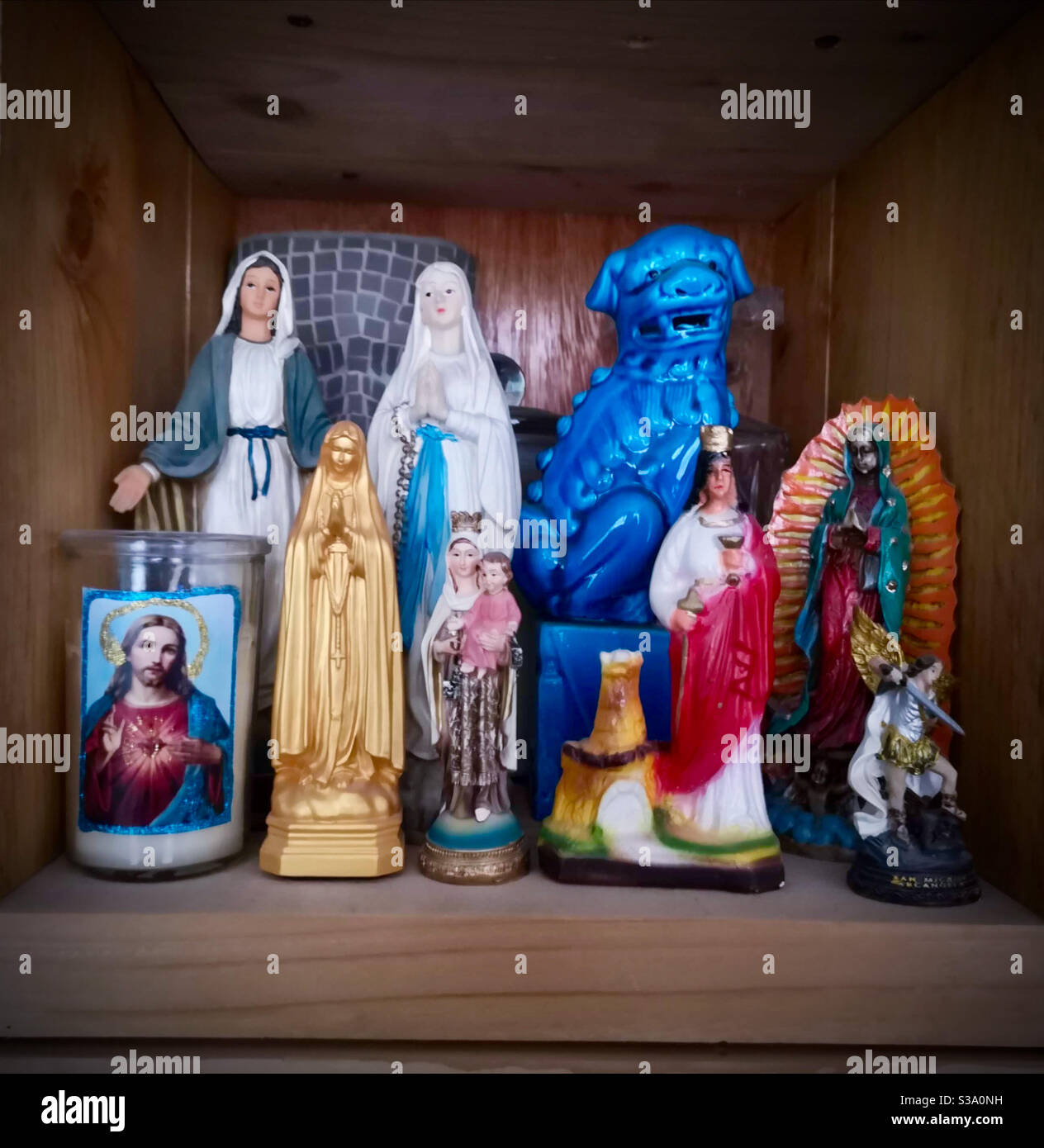 Collection of religious and eclectic statuettes Stock Photo