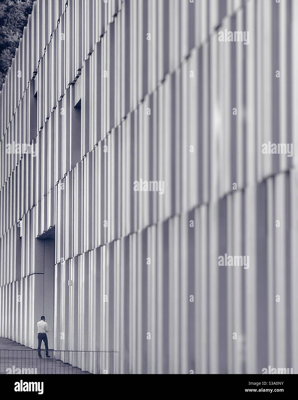 Man entering Swiss Federal Office of Public Health building, Bern, Switzerland - Smartphone Captured Stock Image