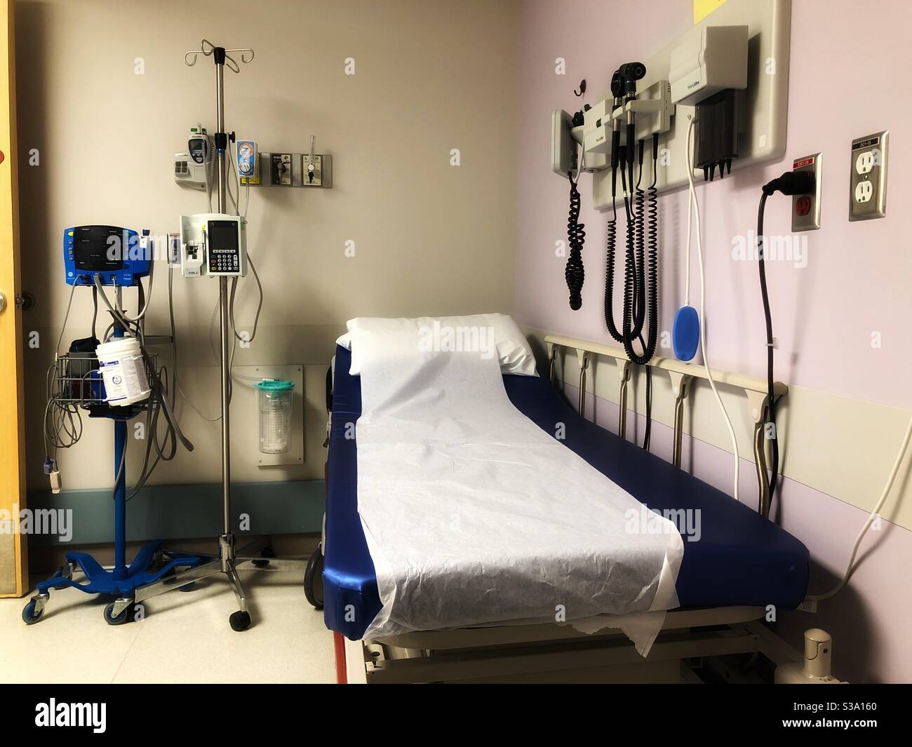 Emergency room hospital bed surrounded by medical equipment. - Smartphone Captured Stock Image