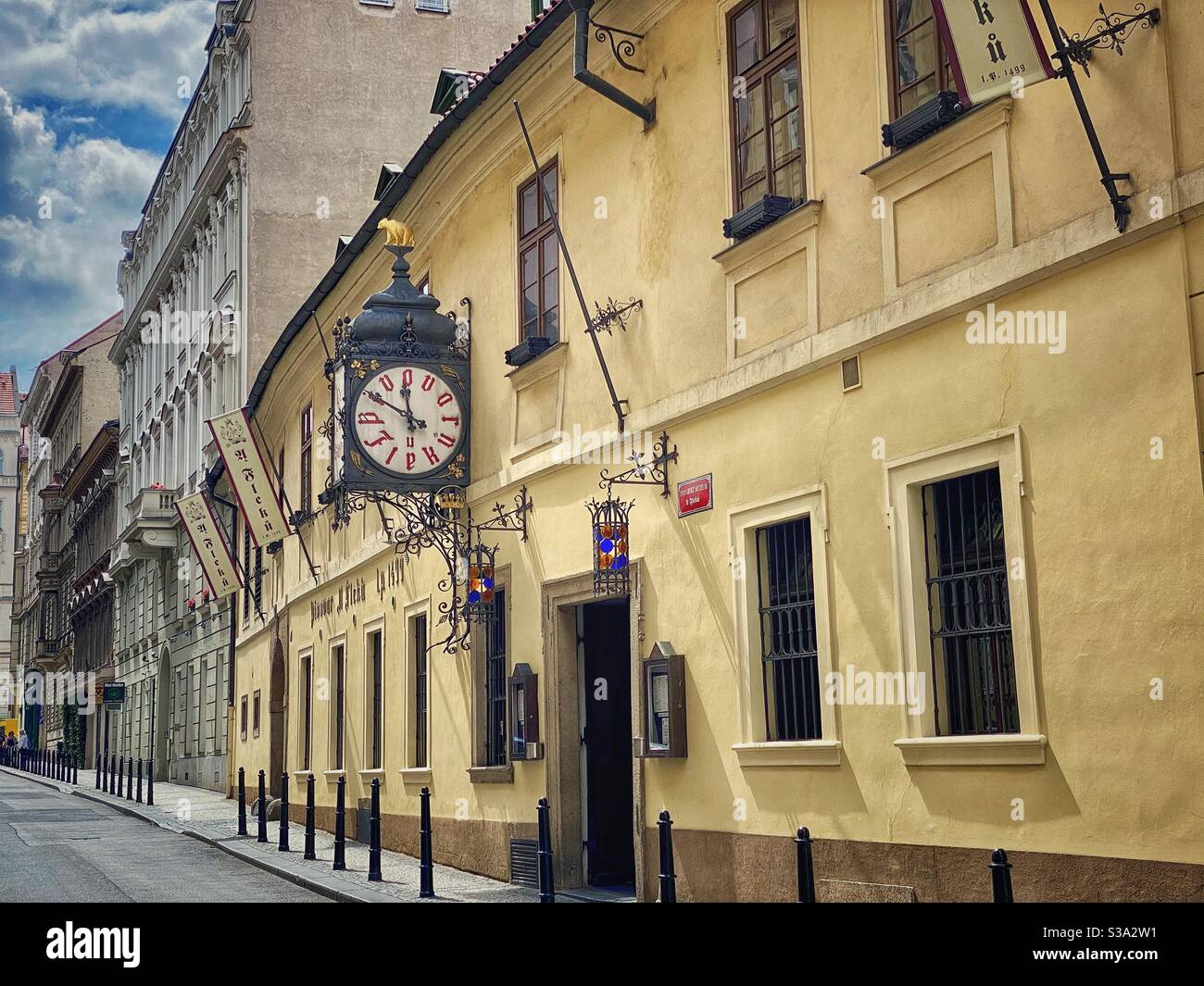 Entrance to the famous ancient brewery U Fleku in the heart of Prague founded in 1499. - Smartphone Captured Stock Image