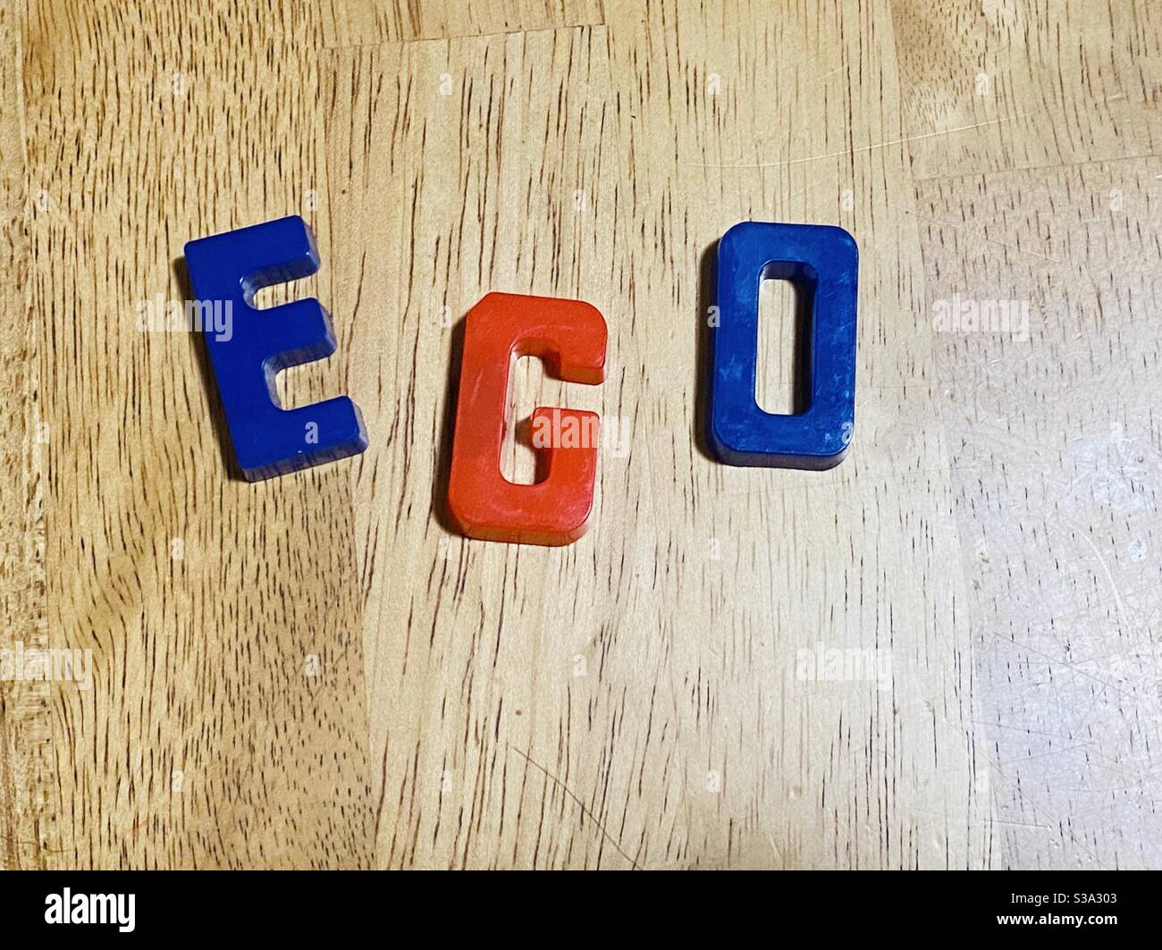 Ego symbol with alphabet magnets Stock Photo