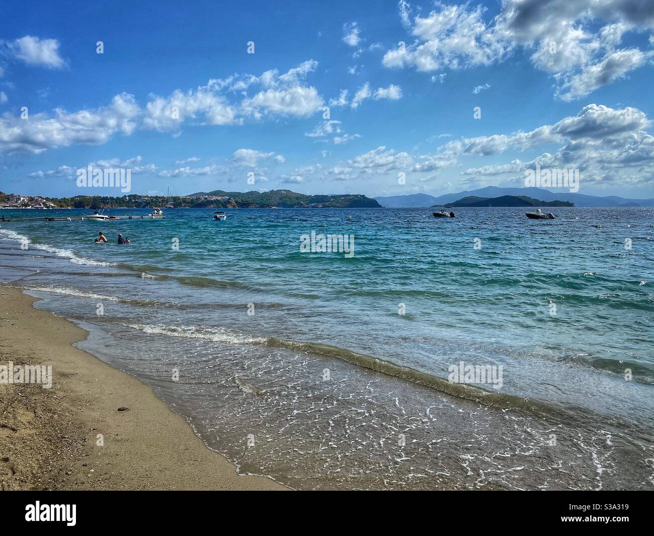 Sea view with boats at Paralia Vasiliasnon Skiathos island in Greece. - Smartphone Captured Stock Image