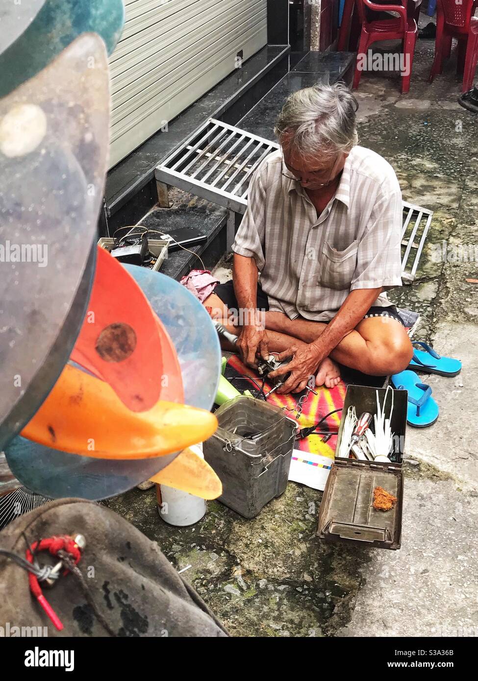 An electric fan repairman, kettle, electric iron. Stock Photo