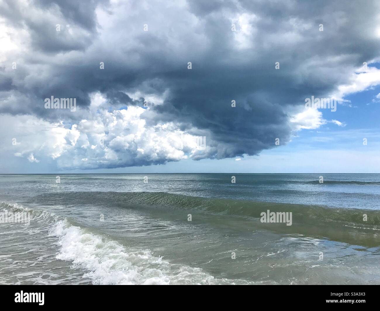 Summer thunderstorm building over the ocean, Jacksonville Beach, Florida - Smartphone Captured Stock Image
