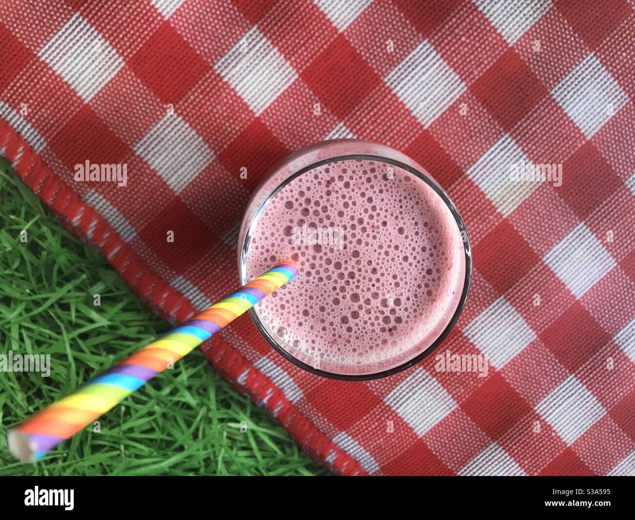 Fruit smoothie against a picnic background Stock Photo