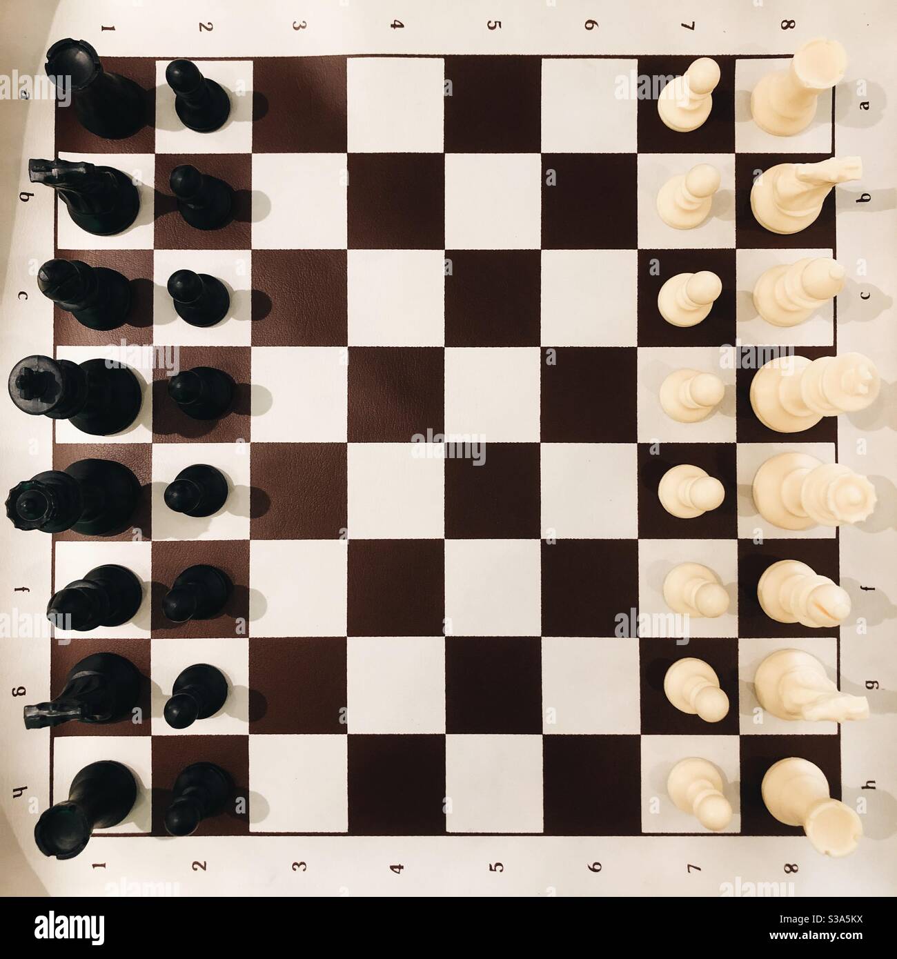 Overhead view of a chess board set up for a game Stock