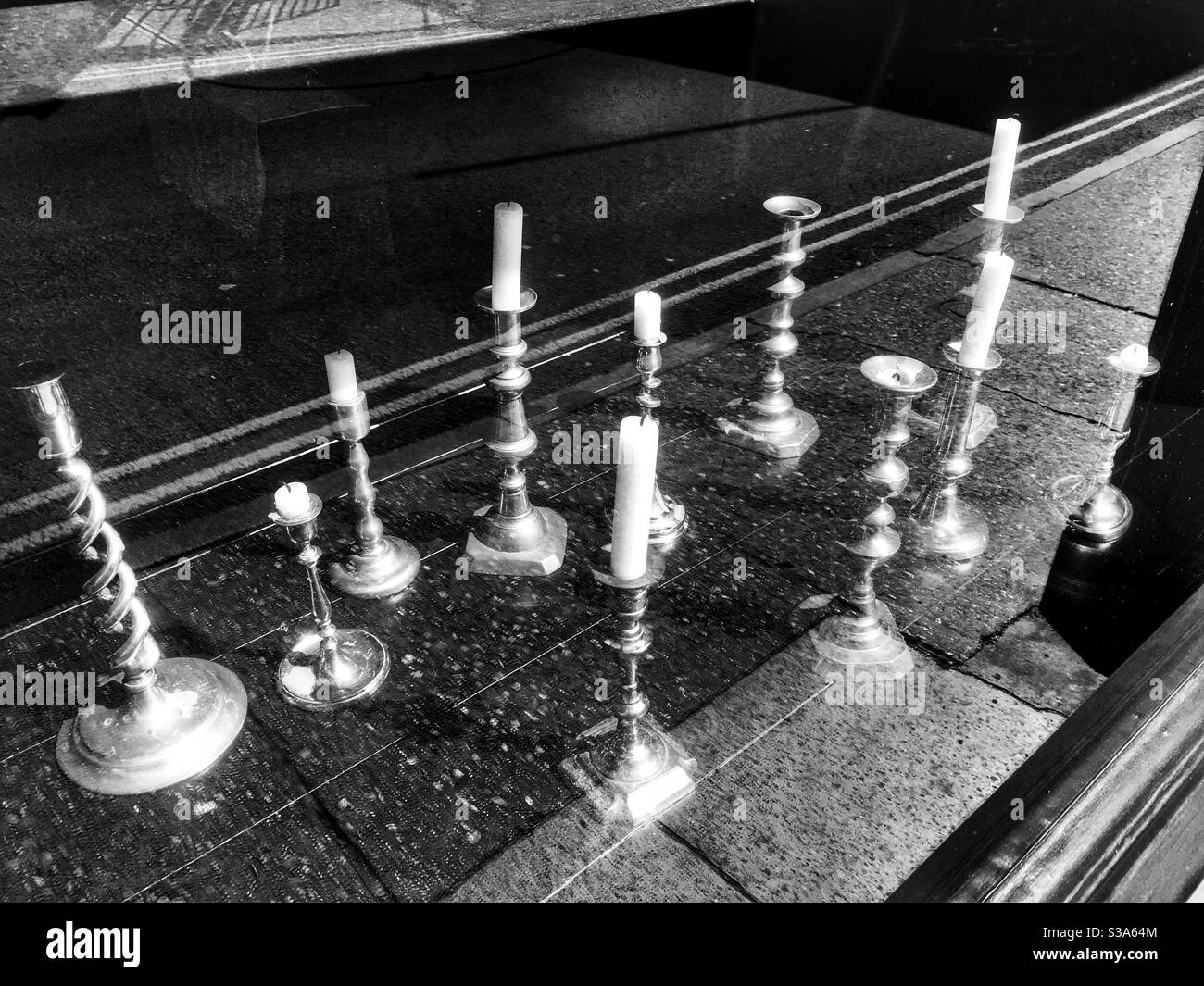 Candlesticks in antiques shop window - Smartphone Captured Stock Image