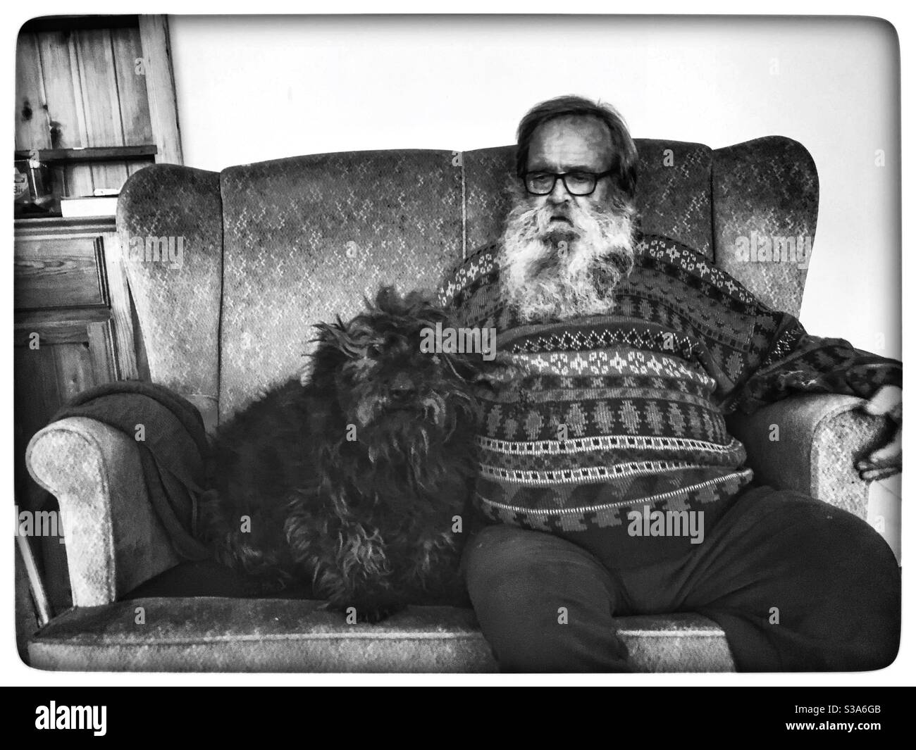 Elderly man with pet dog - Smartphone Captured Stock Image