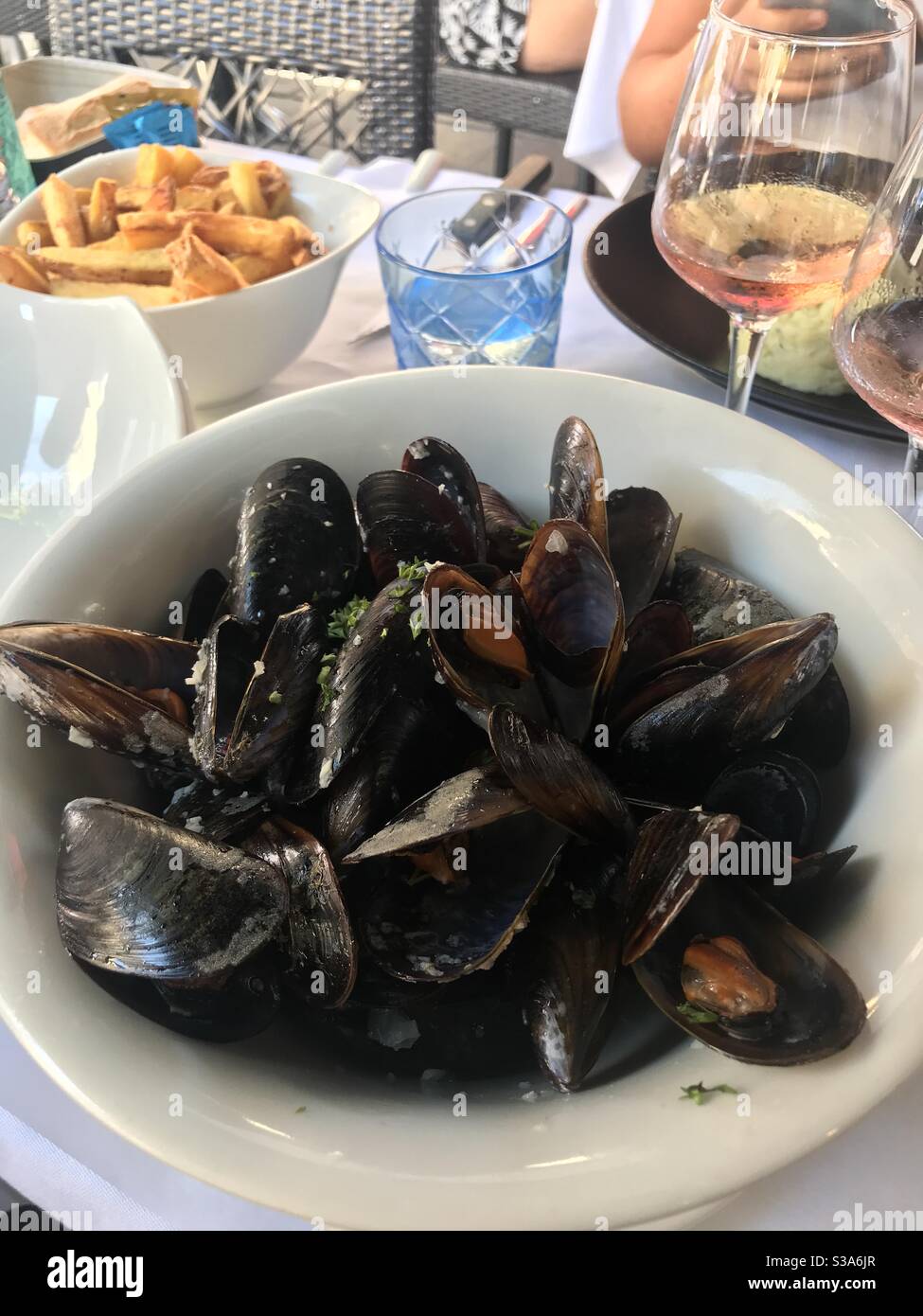A plate of freshly cooked mussels in a garlic and white wine sauce - Smartphone Captured Stock Image