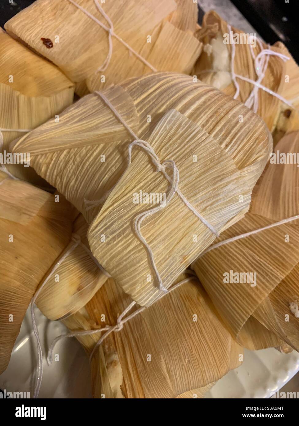Pile of homemade Mexican tamales for a delicious dinner. Stock Photo
