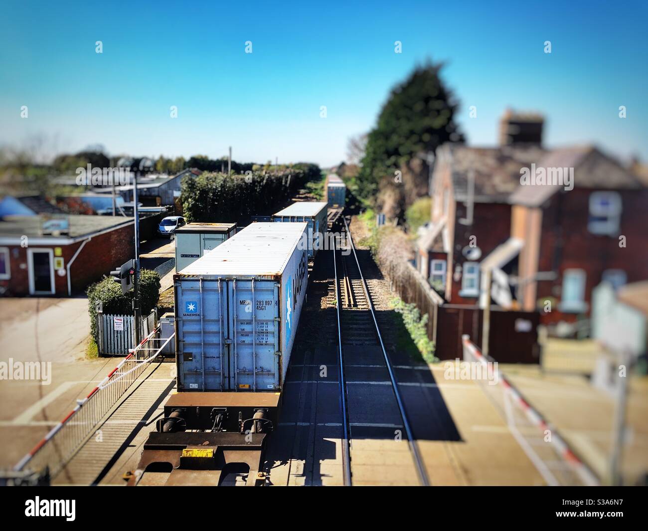 Freight train from the port of Felixstowe entering the single line track to Ipswich at Trimley, Suffolk, UK. - Smartphone Captured Stock Image
