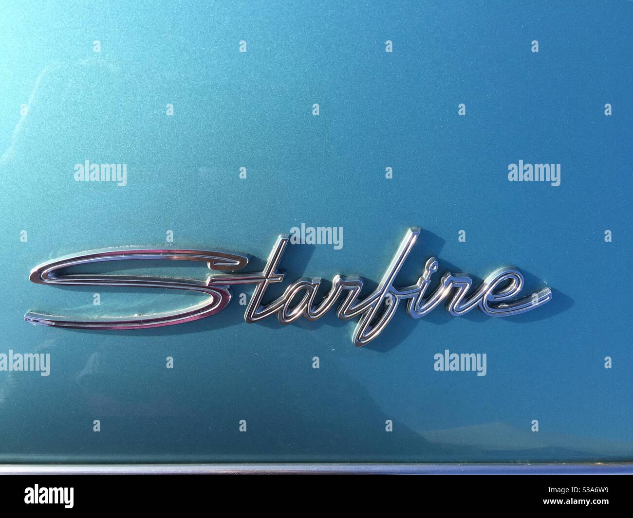 General Motors Oldsmobile Starfire.  Chrome script on a sky blue background Stock Photo