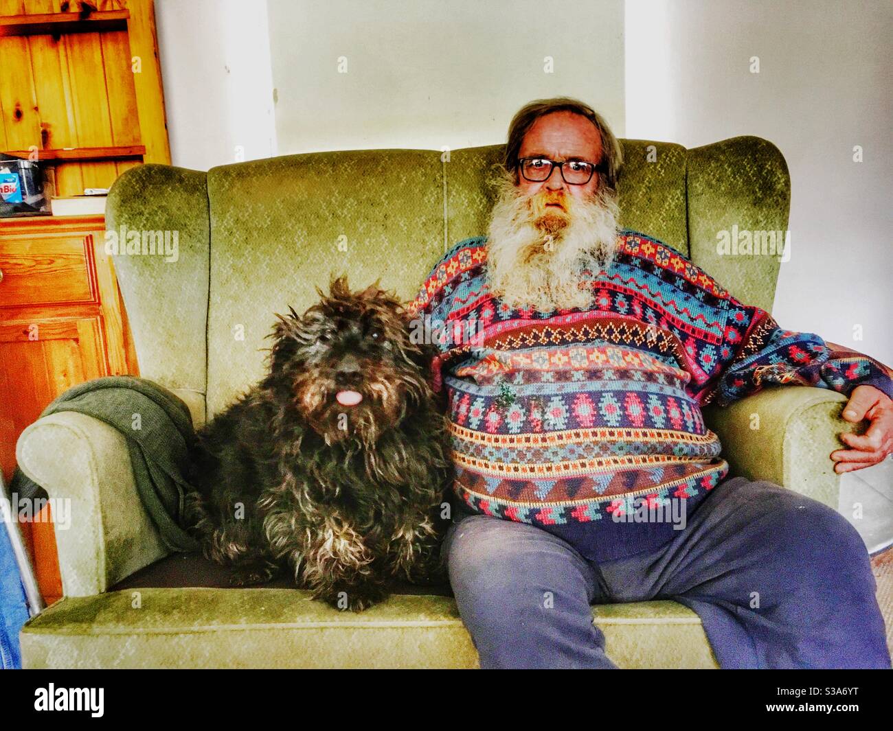 Elderly man with pet dog - Smartphone Captured Stock Image