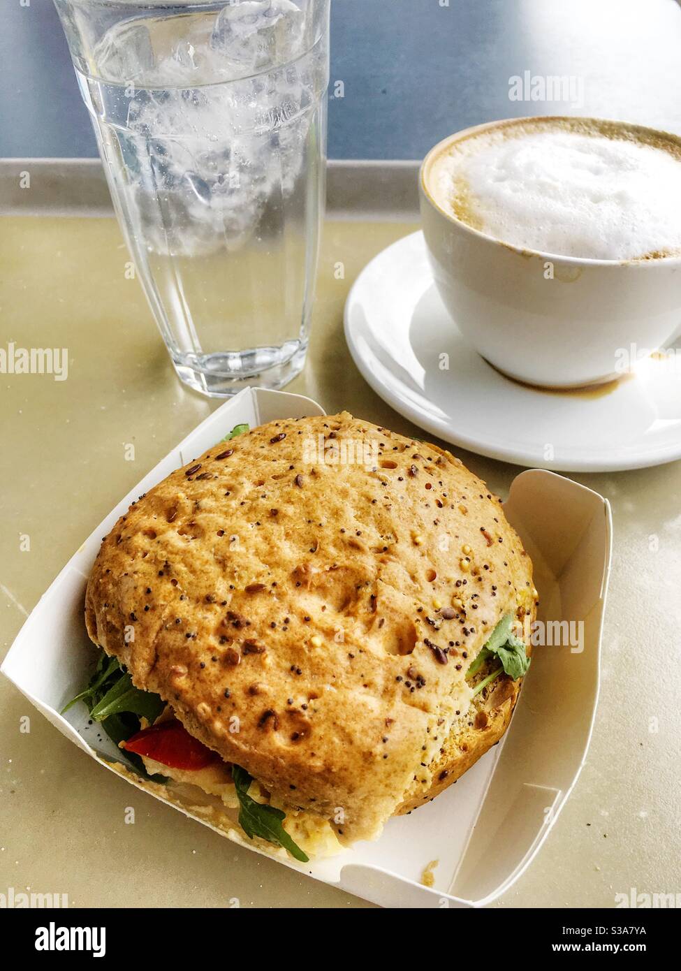 Waitrose cafe egg and cress roll with cappuccino coffee and sparkling water - Smartphone Captured Stock Image
