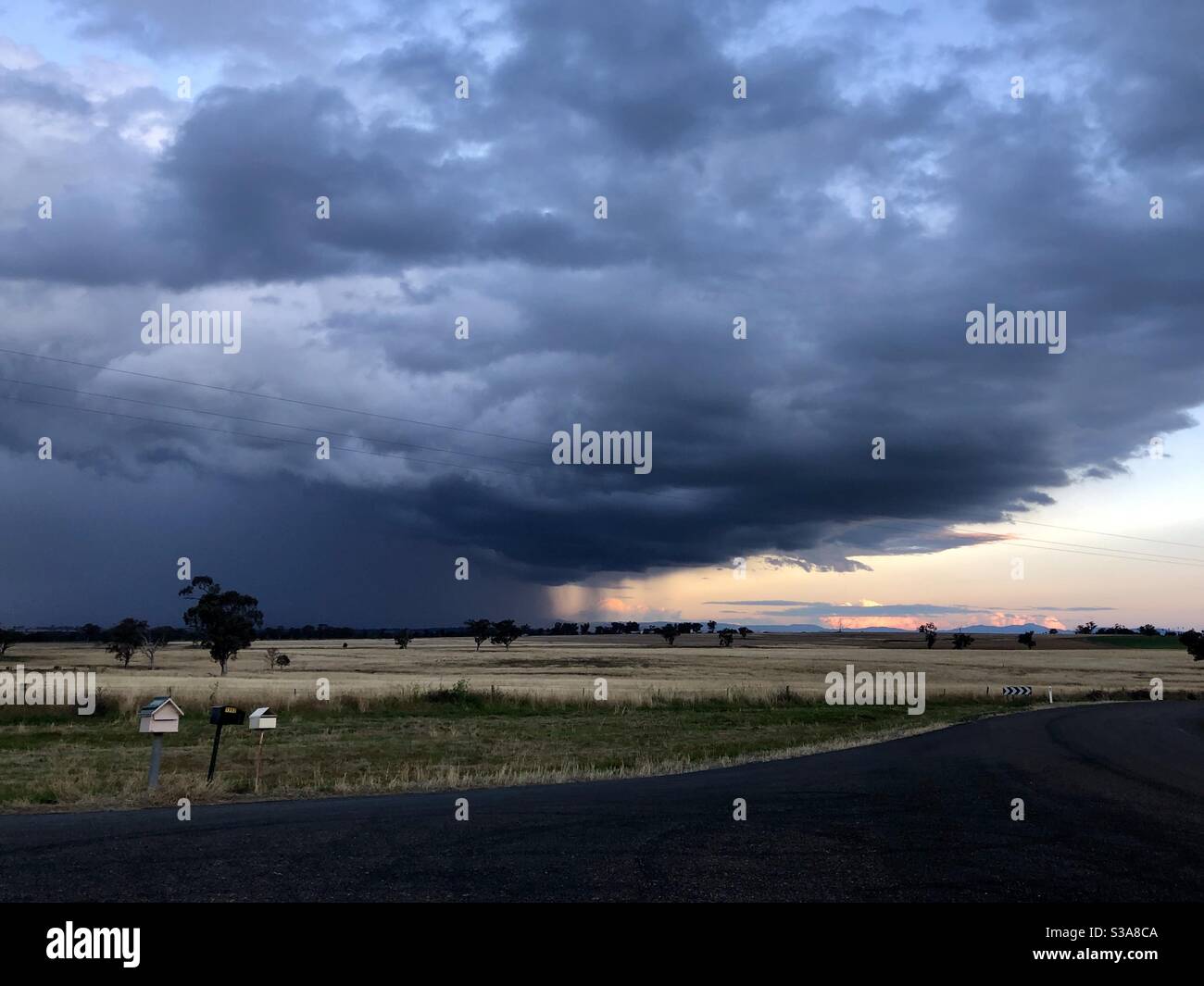 Watching a storm roll by in the countryside of NSW Australia Stock Photo