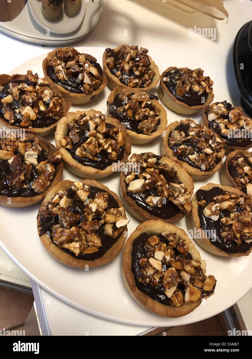 Homemade chocolate tarts with nut brittle Stock Photo Alamy