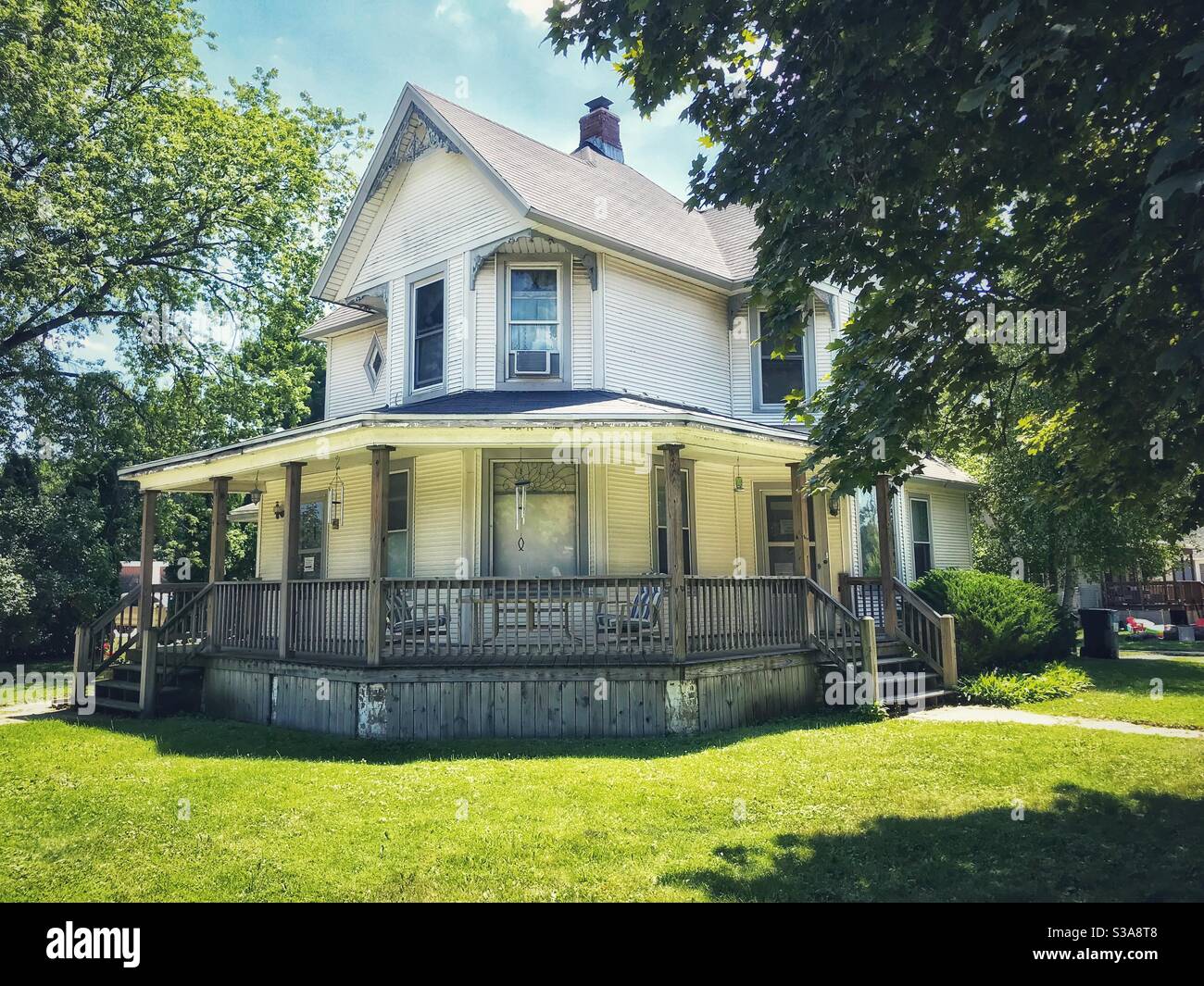 Pretty white Victorian house in a small town in Wisconsin Stock Photo
