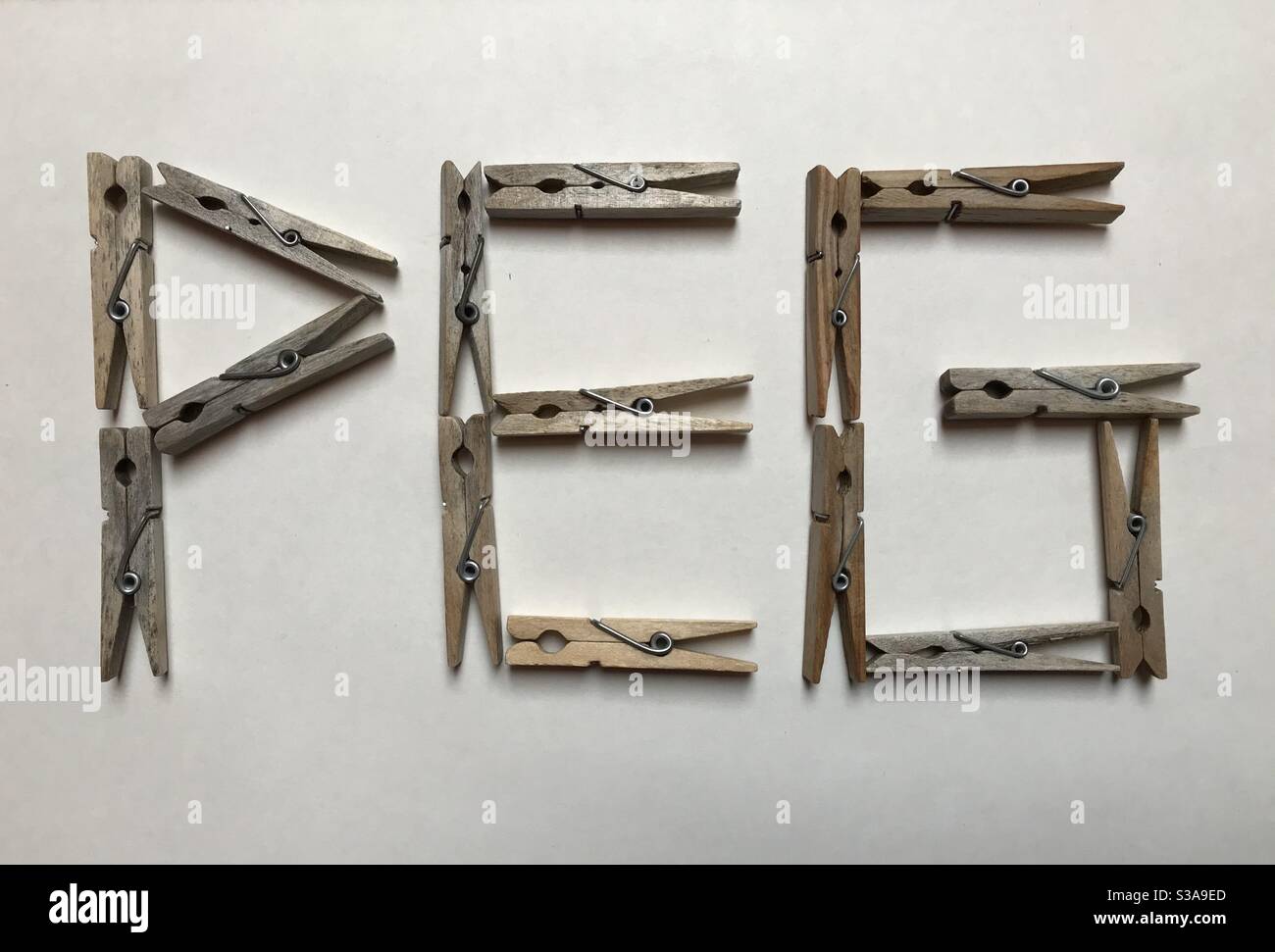 The Word “PEG” Composed of Wooden Pegs Stock Photo Alamy