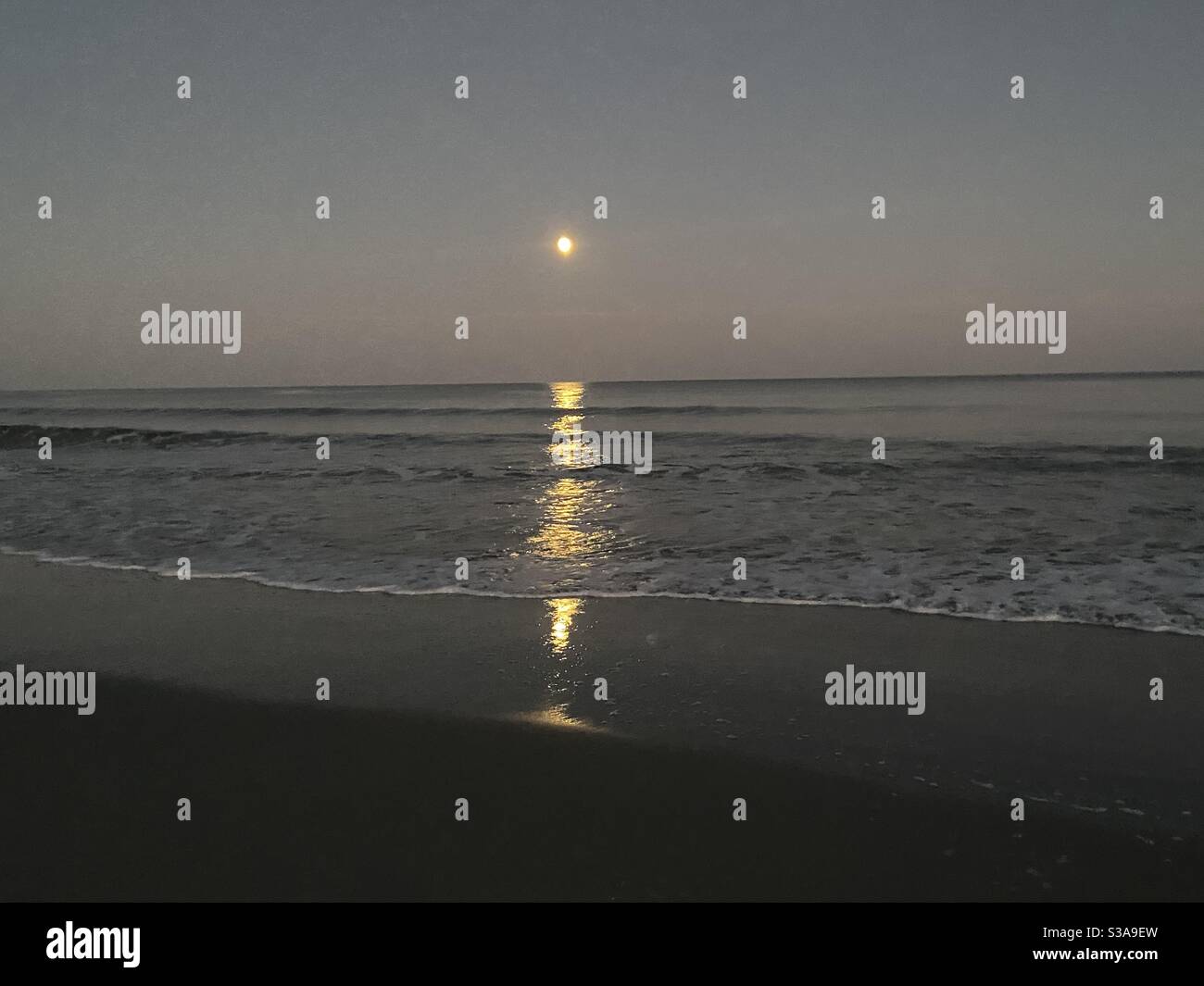 Moonrise over the ocean Stock Photo