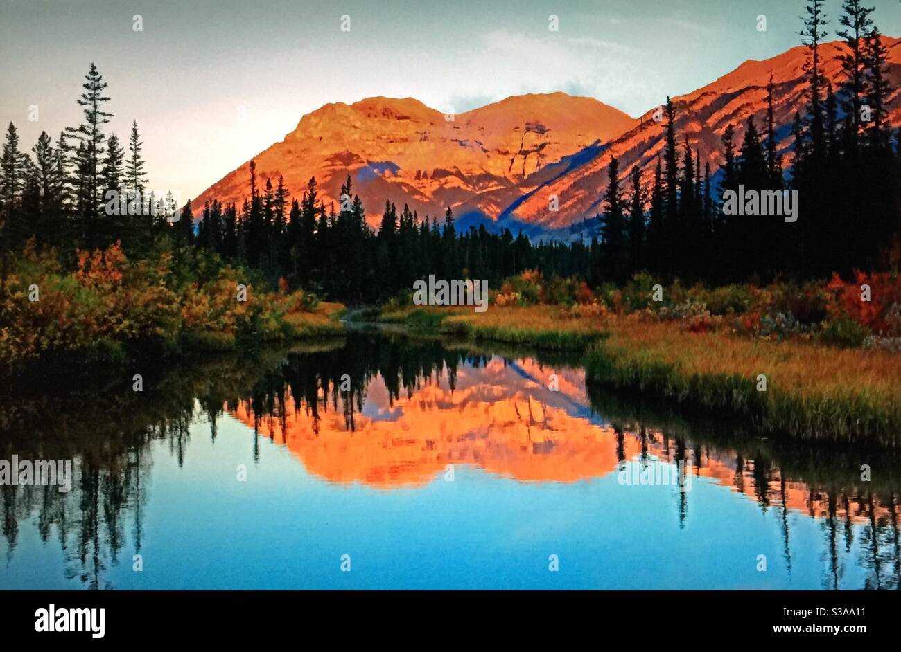 Travelling Alberta, TransCanada highway, roadside pond, near Exshaw,Alberta, reflections, mirror - Smartphone Captured Stock Image