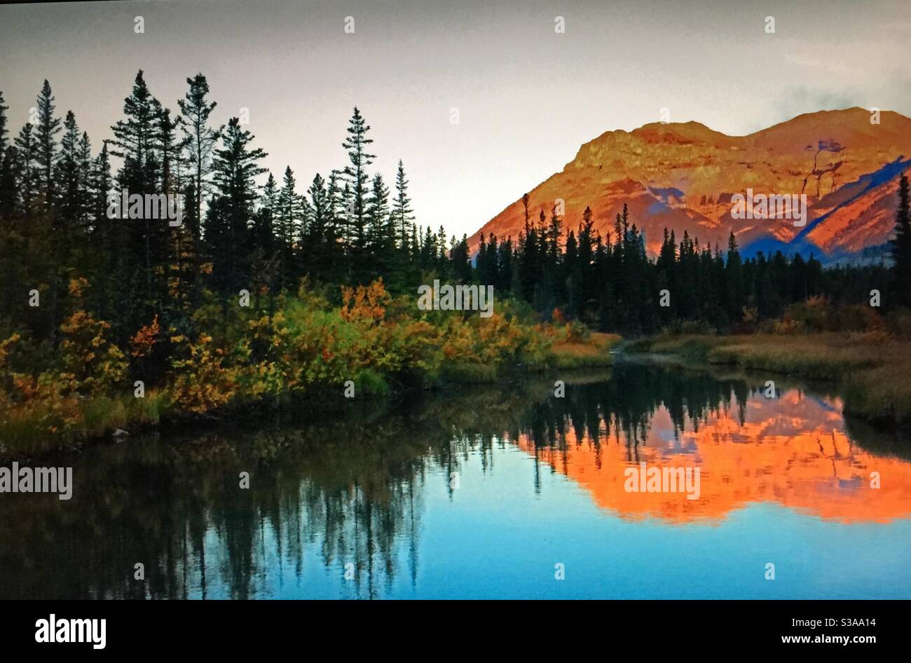 Travelling Alberta, TransCanada highway, roadside pond, near Exshaw,Alberta, reflections, mirror - Smartphone Captured Stock Image