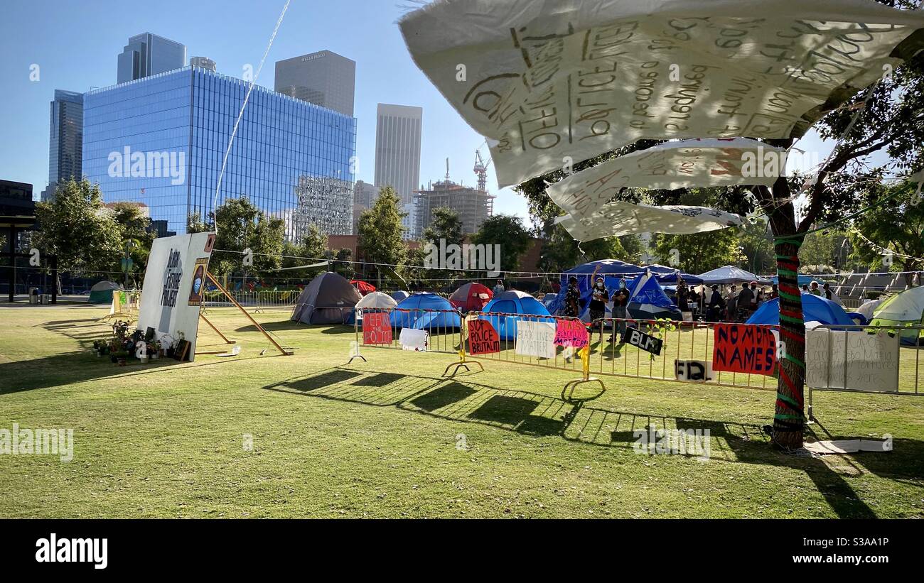 LOS ANGELES, CA, JUL 2020: Tent encampment for Black Lives Matter protestors on Grand Park in Civic Center, Downtown, with federal court building and skyscrapers in background - Smartphone Captured Stock Image