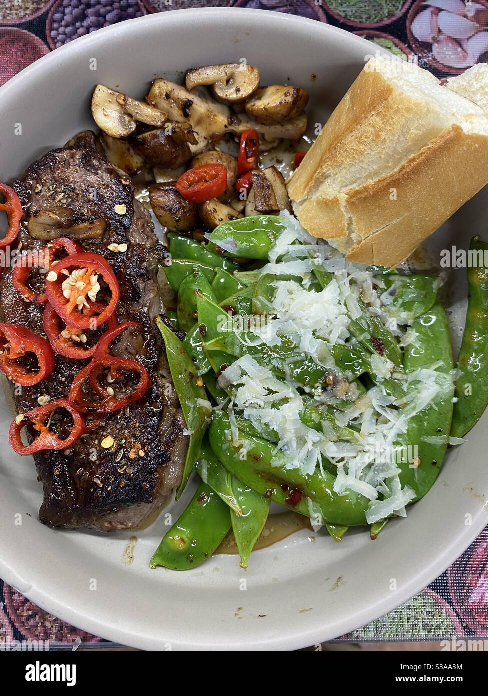 Rump Steak, Red Chilli, Fresh Crusty Role, Lime Butter, Snow Peas and