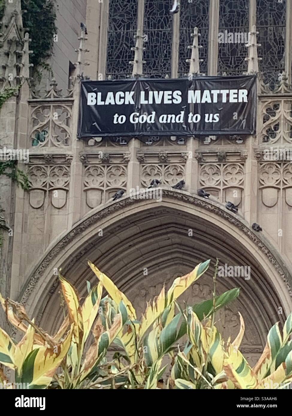 Black Lives Matter to God and to us banner placed on the Fourth Presbyterian Church in downtown Chicago. Stock Photo