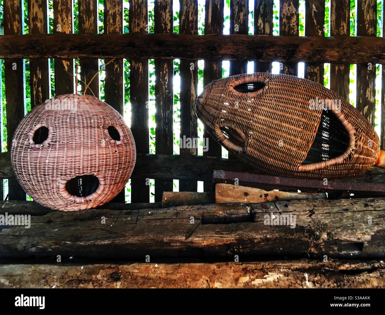 Wicker faces bird feeders - Smartphone Captured Stock Image