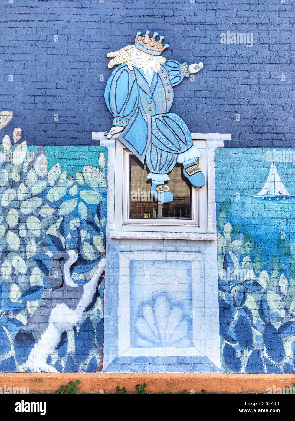 A blue themed mural painted on the side of a wall. - Smartphone Captured Stock Image