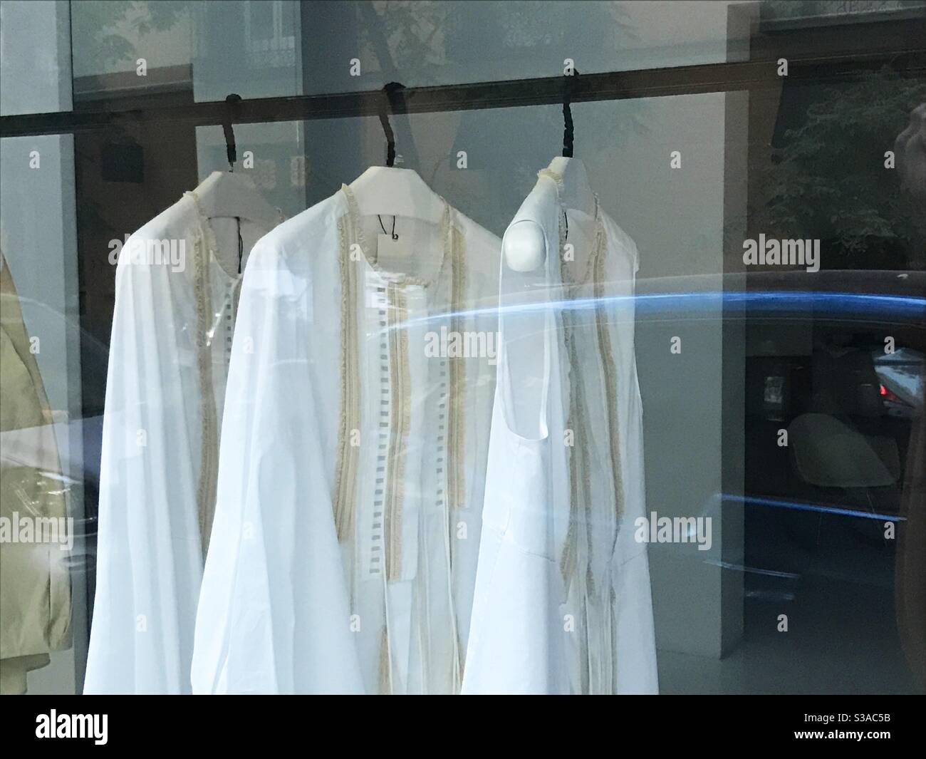 White blouses in a shop window Stock Photo