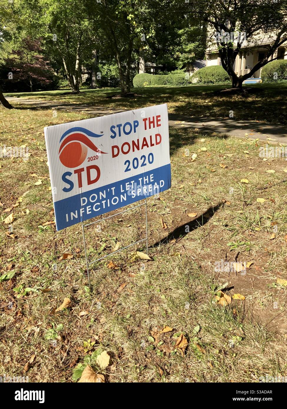 PRINCETON, NJ -View of an anti-Trump political lawn sign saying STD Stop the Donald during the 2020 US presidential campaign in a front yard in New Jersey. Stock Photo