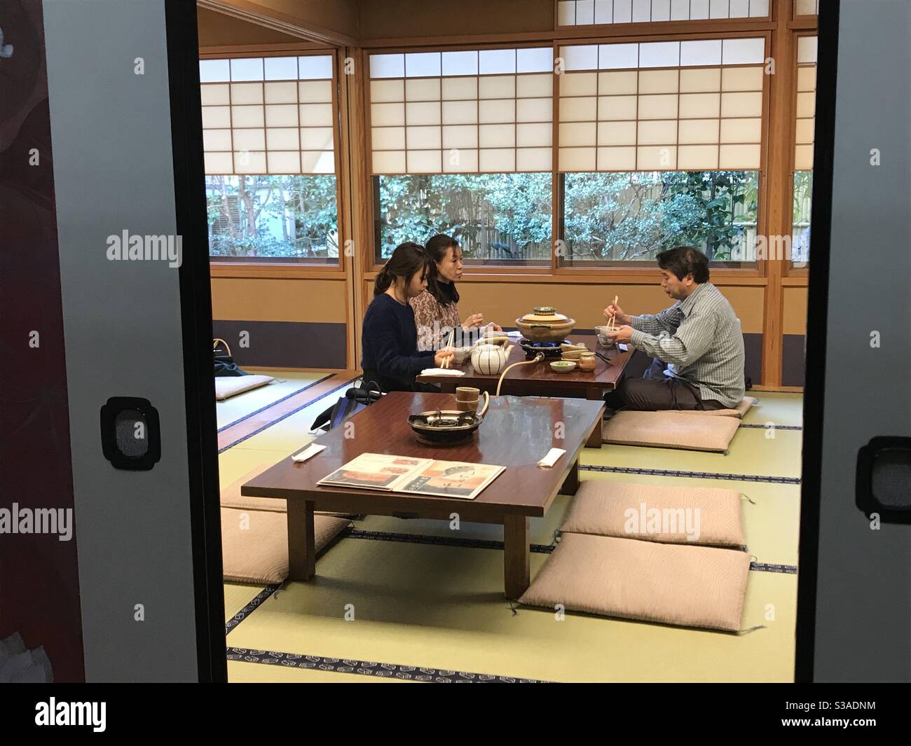 Japanese people dining on low furniture and tatami mat at traditional  Japanese tofu restaurant in Kyoto, Japan Stock Photo - Alamy