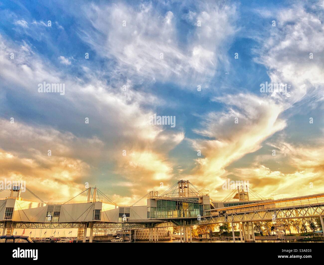 Sun and clouds illuminate the sky. Stock Photo