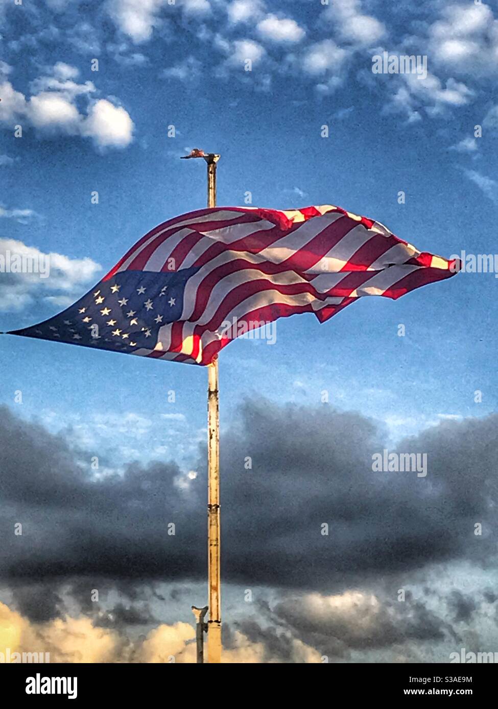 American flag flying Stock Photo