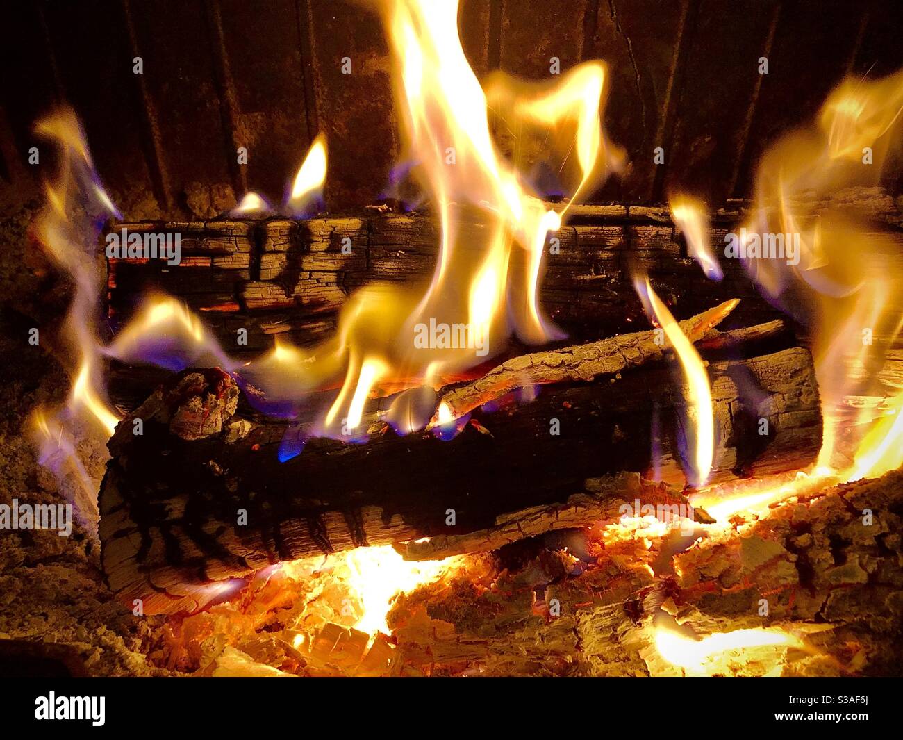 Flaming log fire. - Smartphone Captured Stock Image