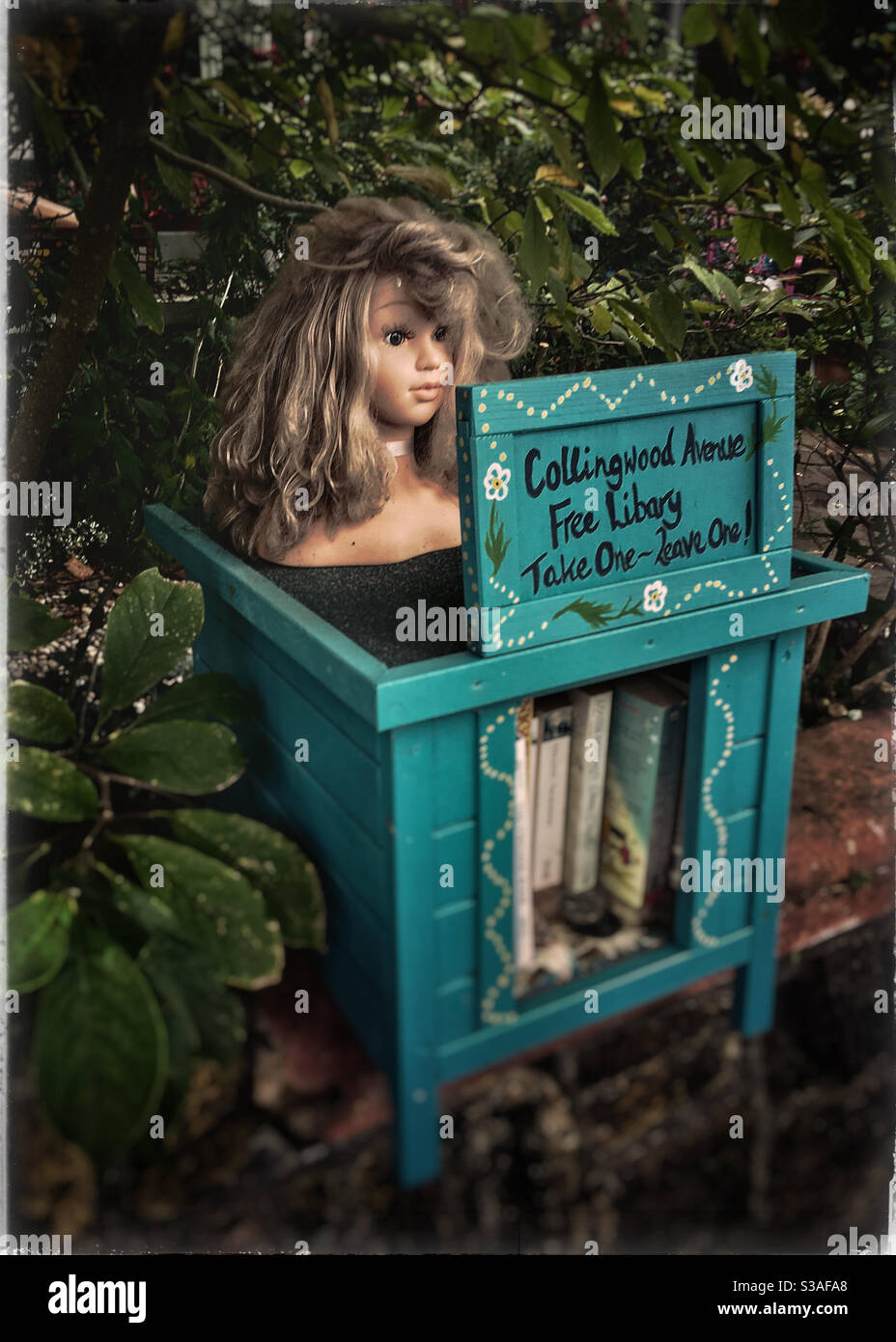 Free neighbourhood library on London street. - Smartphone Captured Stock Image