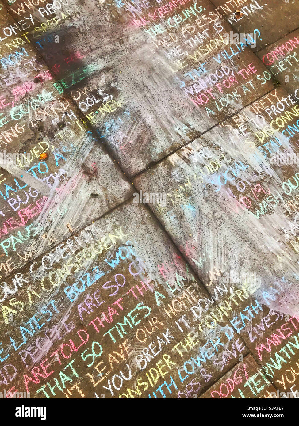 QAnon theory chalked onto a pavement in the UK - Smartphone Captured Stock Image