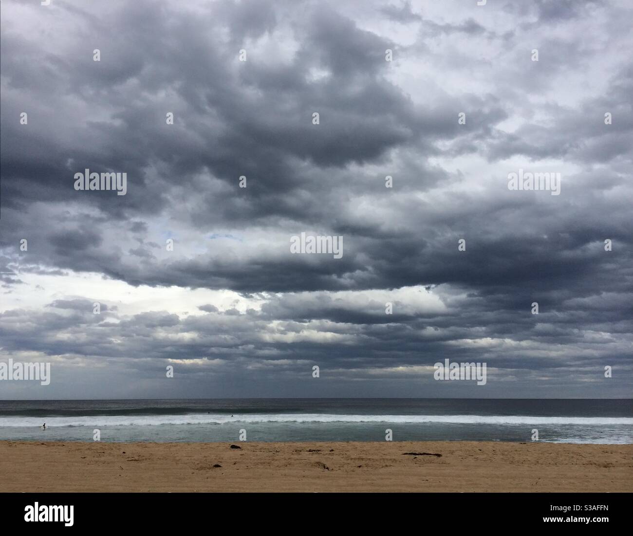 Storm clouds gather over Stanwell Park beach NSW, Australia. Stock Photo