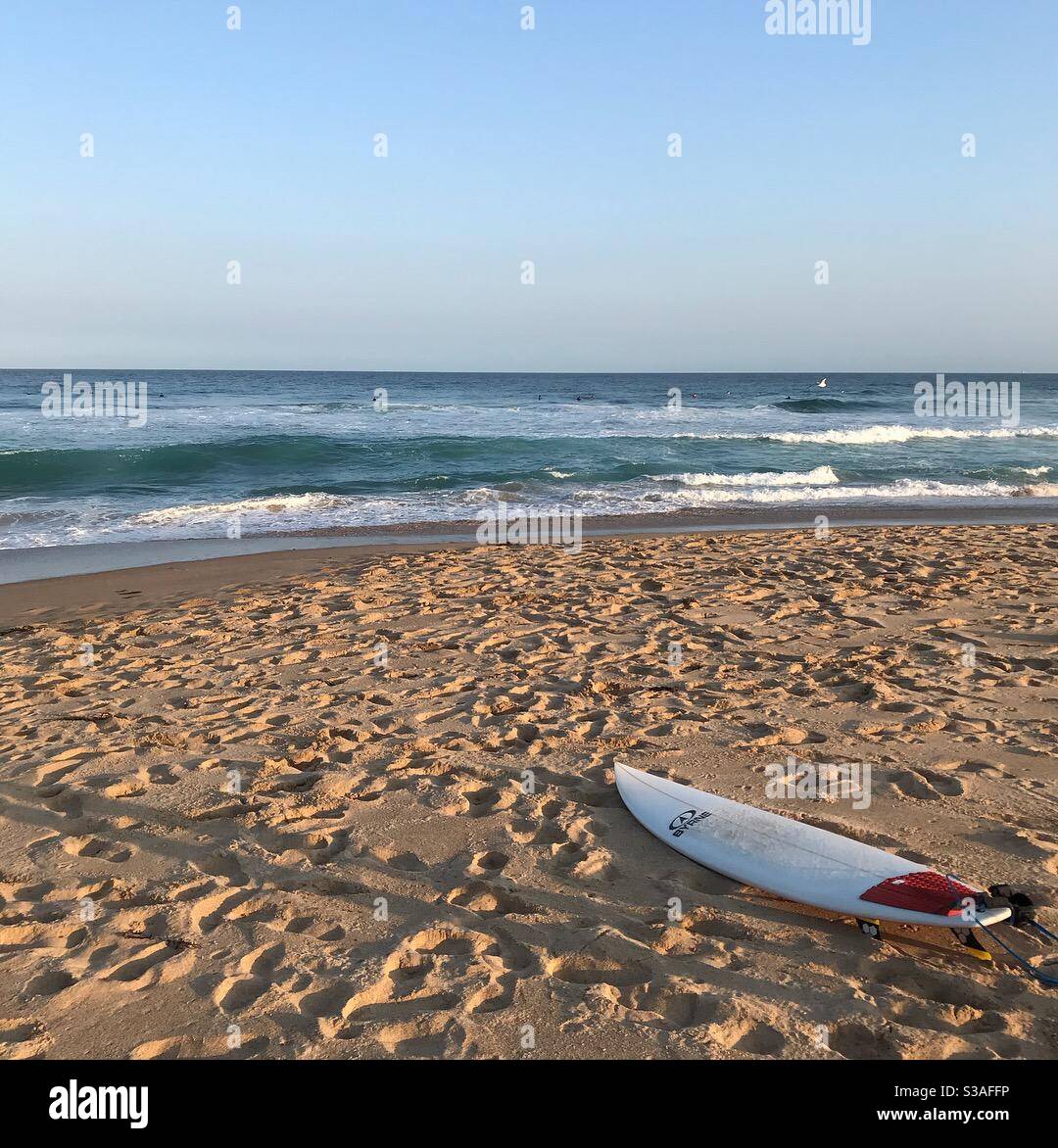 Surfboard on the beach at Stanwell Park, NSW Australia Stock Photo