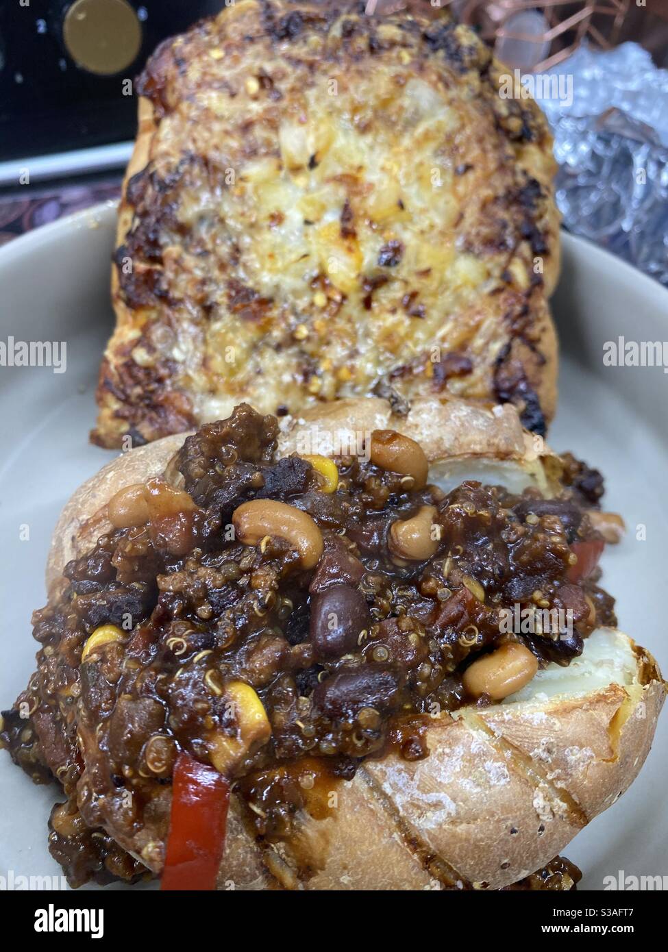 Chilli Jacket Potato and Pesto BBQ flat bread Stock Photo Alamy
