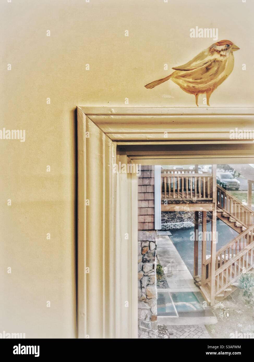 Painted bird over window - Smartphone Captured Stock Image