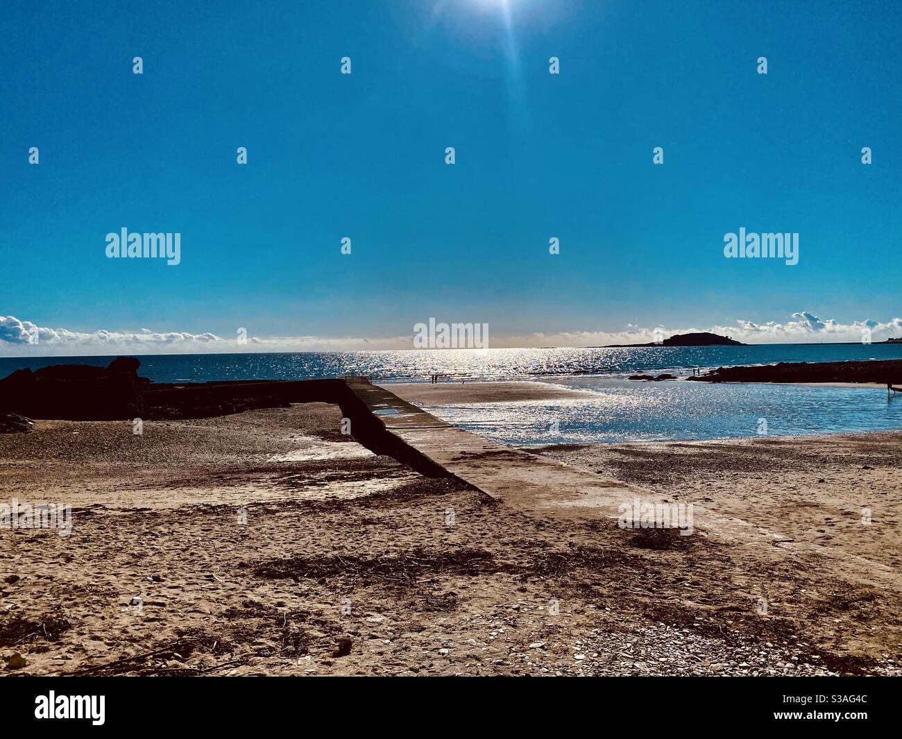 Looe island in the distance - Cornwall sunset & beach view  from Millendreath - Smartphone Captured Stock Image