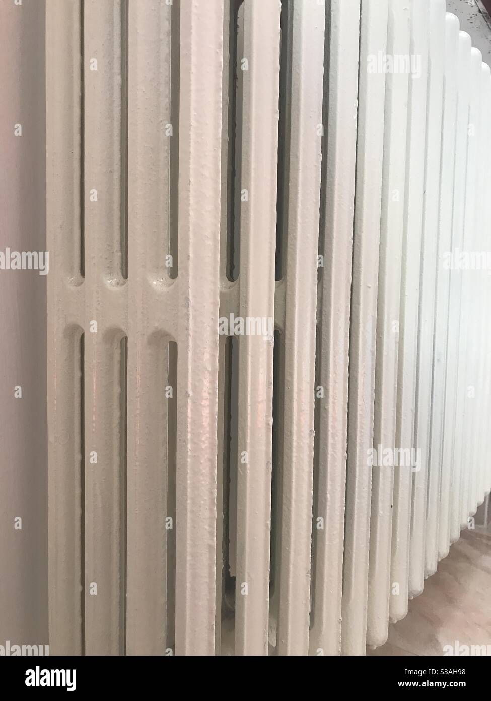 A white indoor radiator seen from an angle Stock Photo