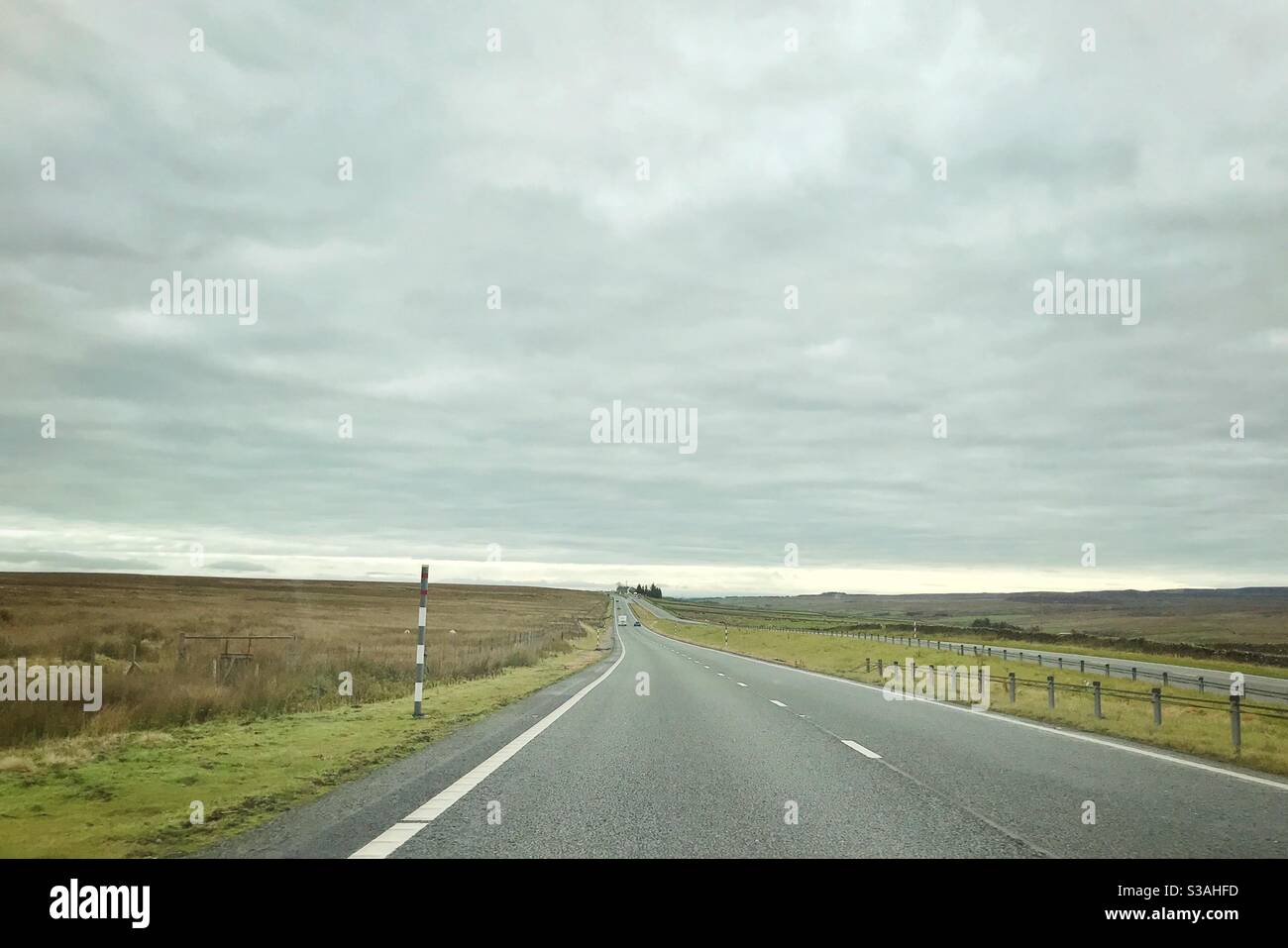Road over moorlands in autumn - Smartphone Captured Stock Image