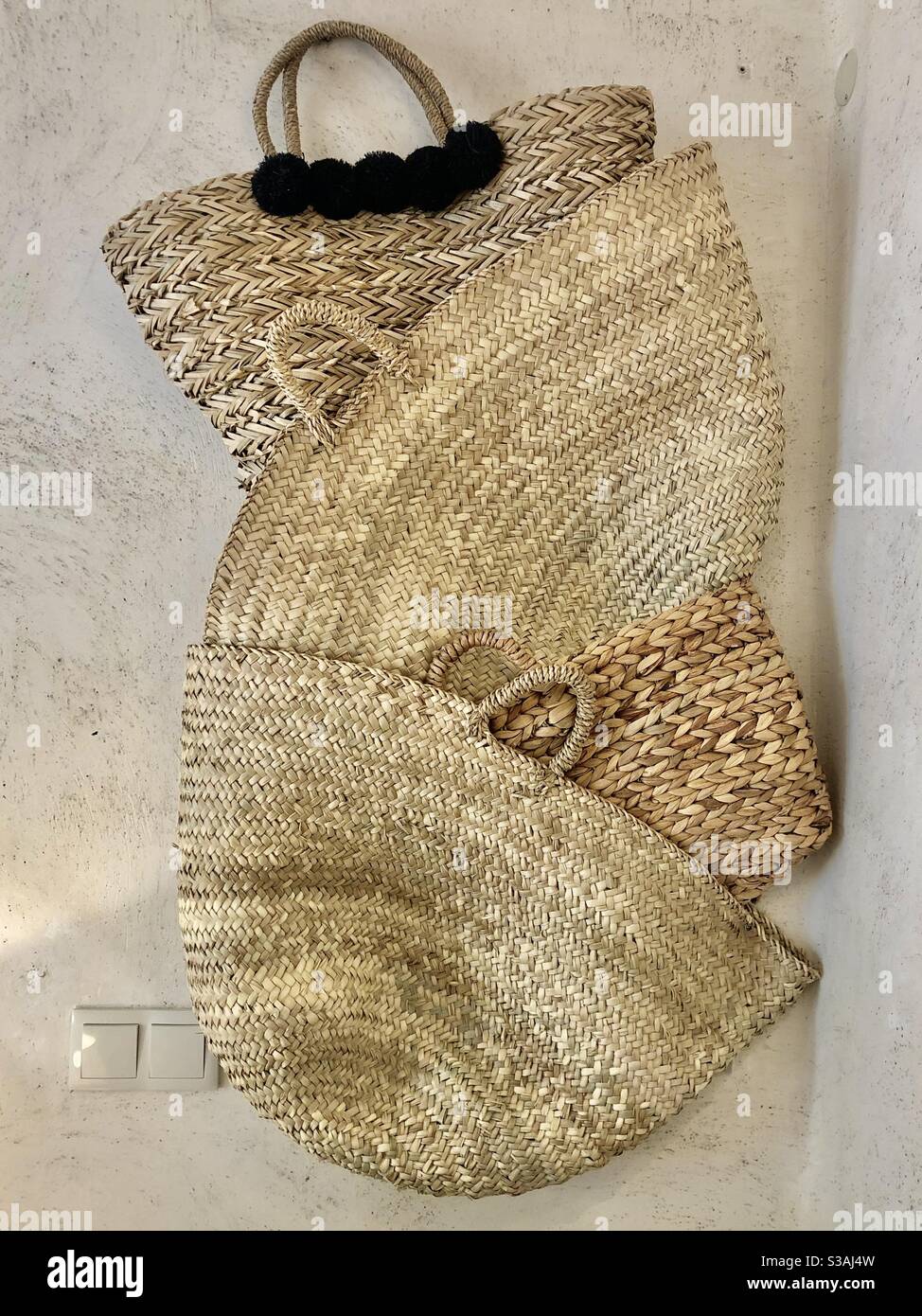 Wicker baskets decorating a wall Stock Photo Alamy