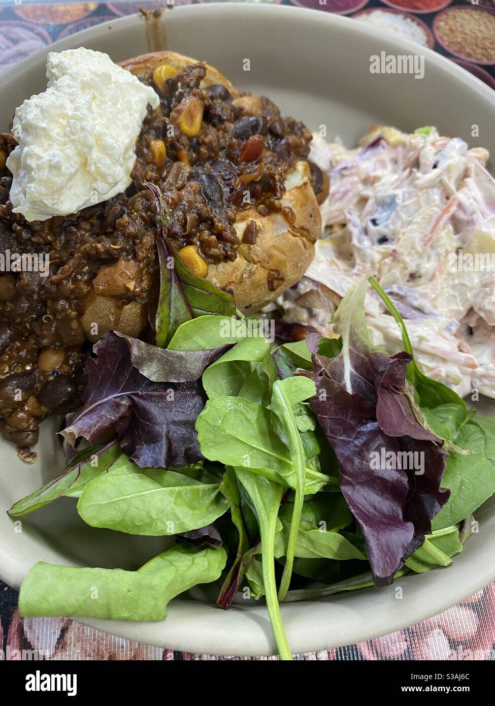 Chilli Jacket Potato, Homemade Coleslaw, and Greens Stock Photo Alamy