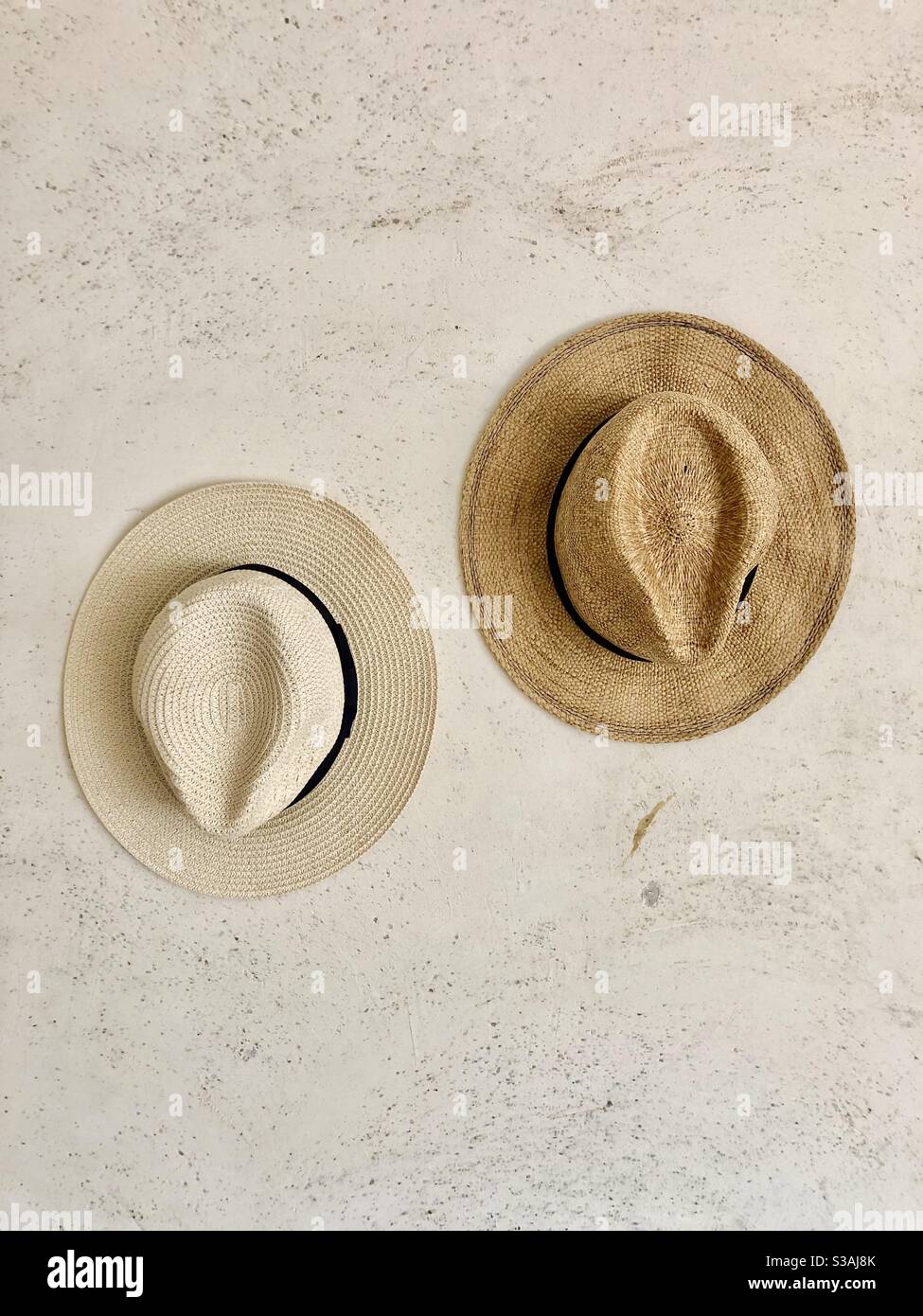 Two hats on a wall Stock Photo Alamy