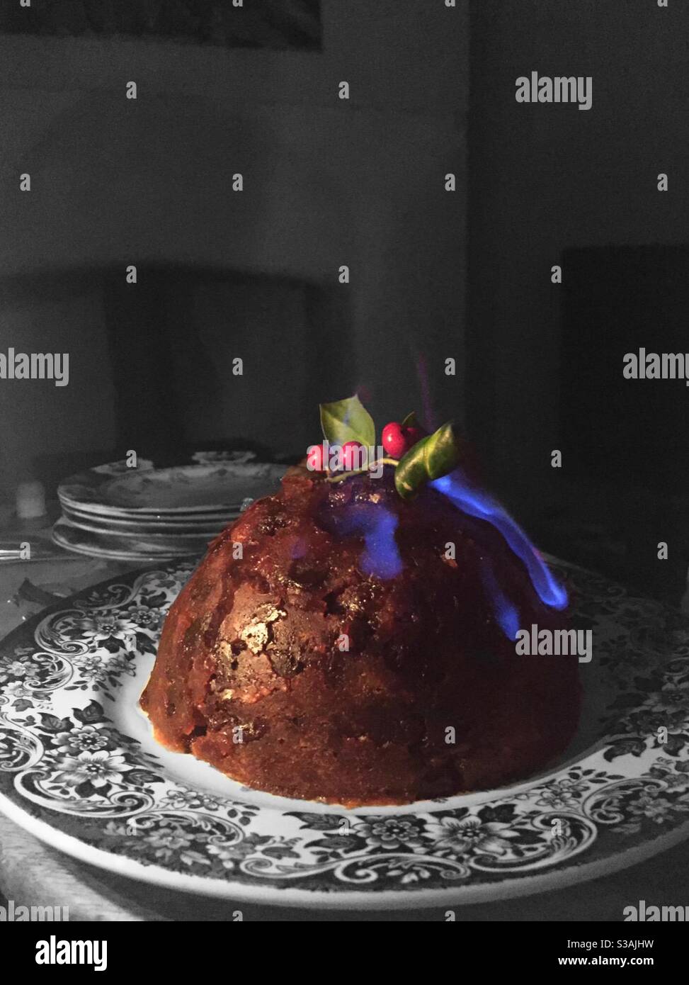 Christmas Pudding burning with blue flame - Smartphone Captured Stock Image