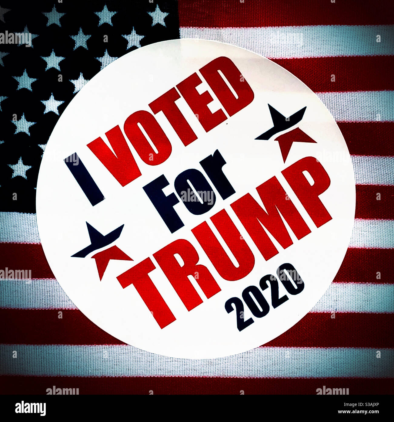 Trump 2020 sticker on American flag Stock Photo